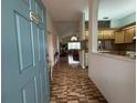 Foyer view showing tile flooring leading to the living room and kitchen with open floorplan at 11147 Sw 68Th Ct, Ocala, FL 34476