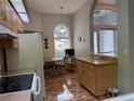 Eat-in kitchen area features arched window overlooking the front yard at 11147 Sw 68Th Ct, Ocala, FL 34476