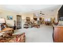 Spacious living room with recessed lighting and a fireplace at 2360 Hopespring Loop, The Villages, FL 32162