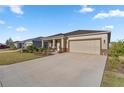 House exterior showcasing a well-maintained lawn and driveway at 7682 Sw 89Th Ct, Ocala, FL 34481