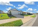 House exterior showing a driveway and well-maintained lawn in a residential neighborhood at 8456 Sw 52Nd Lane Rd, Ocala, FL 34481