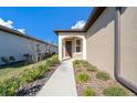 Welcoming front entry with a walkway and landscaping at 5624 Sw 88Th Ave, Ocala, FL 34481