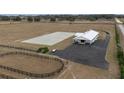 Aerial view of horse barn, arena, and round pen at 2190 Nw 110Th Ave, Ocala, FL 34482