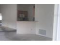 Open living room with kitchen views at 321 Katherine Pl, The Villages, FL 32162