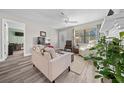 Living room with hardwood floors, fireplace, and view to additional room at 4055 Ne 29Th Ct, Ocala, FL 34479