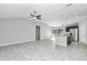 Open concept living area with tile flooring and a high ceiling at 963 Nw 65Th St, Ocala, FL 34475