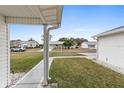 Side yard view showing a residential street and homes at 9802 Se 178Th Ln, Summerfield, FL 34491