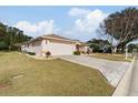 Charming one-story home with a large backyard and brick driveway at 9910 Se 138Th Loop, Summerfield, FL 34491