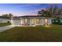 New construction home with gray roof, well-maintained lawn at 15498 Sw 8 Pl, Ocala, FL 34481