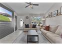 Spacious living room featuring a neutral color palette and large windows at 20 Fir Dr, Ocala, FL 34472