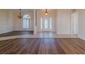 Bright and airy entrance hall with tiled flooring and a view into the dining room at 2045 Nw 56Th Ter, Ocala, FL 34482