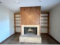 Brick fireplace with wood mantel and shelving at 2191 Ne 40Th St, Ocala, FL 34482