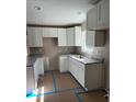 Modern kitchen with white cabinets and granite countertops at 22564 Sw Rainbow Lakes Blvd, Dunnellon, FL 34431