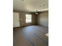 Spacious living room with ceiling fan and neutral walls at 22564 Sw Rainbow Lakes Blvd, Dunnellon, FL 34431