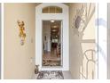 Inviting entryway with decorative wall art and a view into the home at 4 Diamond Cove Ct, Ocala, FL 34472