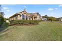 Beautiful home exterior with well-manicured lawn and landscaping at 4020 Se 9Th Ave, Ocala, FL 34480