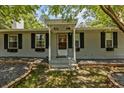 Front entrance of a cozy house with a covered porch at 7885 Sw 202Nd Ave, Dunnellon, FL 34431