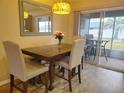 Bright dining room with table and chairs, and access to patio at 8187 Sw 60Th Ter, Ocala, FL 34476