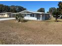 House with a carport and a large yard at 8973 Sw 101St Ln, Ocala, FL 34481