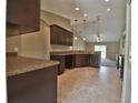 Modern kitchen with ample cabinet space and tile flooring at 14269 Se 27Th Ct, Summerfield, FL 34491