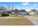 Single-story home with a large yard and attached garage at 15154 Sw 38Th Cir, Ocala, FL 34473