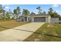 Newly built home with a long driveway and a fenced yard at 16689 Sw 22Nd Terrace Rd, Ocala, FL 34473