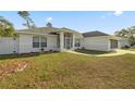 Charming house showcasing a well-manicured lawn and screened porch at 16689 Sw 22Nd Terrace Rd, Ocala, FL 34473