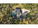 Aerial view showing house, pool, and surrounding landscape at 5224 Se 44Th Cir, Ocala, FL 34480