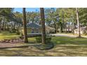 House exterior showcasing landscaping and a basketball court at 5224 Se 44Th Cir, Ocala, FL 34480