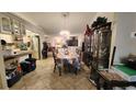 Dining room with table, chairs, and views to kitchen and living room at 5491 Sw 100Th Loop, Ocala, FL 34476