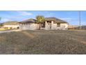 House exterior showcasing a palm tree and driveway at 5525 Sw 80Th Pl, Ocala, FL 34476