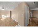 Light and bright hallway with laminate flooring at 562 Silver Course Loop, Ocala, FL 34472