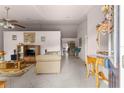 Bright living room with neutral colored furniture and tile floors at 7 Bahia Circle Loop, Ocala, FL 34472