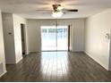 Spacious living room featuring tile flooring and a sliding glass door at 15120 Sw 39Th Cir, Ocala, FL 34473