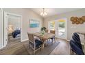 Charming dining area with a rustic wooden table and four chairs at 18 Juniper Trl, Ocala, FL 34480