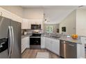 Modern kitchen with stainless steel appliances and granite countertops at 18 Juniper Trl, Ocala, FL 34480