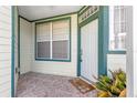 Front entry with tiled flooring, white door and window at 231 Ne 28Th Ave # 204, Ocala, FL 34470