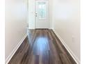 Bright entryway with wood-look floors and white walls at 2457 Bulrush Dr, Saint Cloud, FL 34769