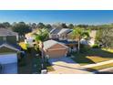 Two-story house with a gray roof, attached garage and a driveway at 4098 Sw 51 St, Ocala, FL 34474