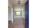 Bright entryway with new carpet and a view of the living room at 421 Spring Ln, Ocala, FL 34472