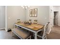 Bright dining room with a table and bench seating at 5053 Se 89Th St, Ocala, FL 34480