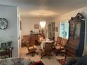 Dining room with wood table and chairs, and antique cabinet at 533 Midway Dr # B, Ocala, FL 34472