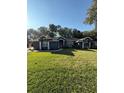 House exterior showcasing a well-maintained lawn and a two-car garage at 5579 Se 44Th Cir, Ocala, FL 34480