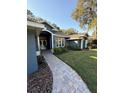 Front entry with a brick walkway leading to the house entrance at 5579 Se 44Th Cir, Ocala, FL 34480