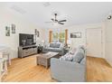 Bright living room featuring hardwood floors and ample natural light at 7994 Se 174Th Belhaven Loop, The Villages, FL 32162