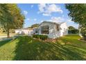 Side view of a single-story house with landscaping at 1616 San Diego St, The Villages, FL 32159