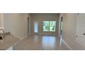 Spacious living area featuring ceramic tile floors and large windows at 2146 Nw 23Rd Loop, Ocala, FL 34475