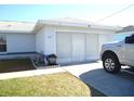Attached garage with double doors and driveway at 221 Locust Ln, Ocala, FL 34472