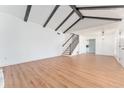 Living room with vaulted ceiling, hardwood floors, and a staircase at 4343 Nw 80Th Ave # 4, Ocala, FL 34482