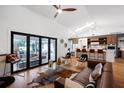 Bright living room featuring a large folding door that opens to an outdoor living space at 4400 Sw 20Th Ave, Ocala, FL 34471